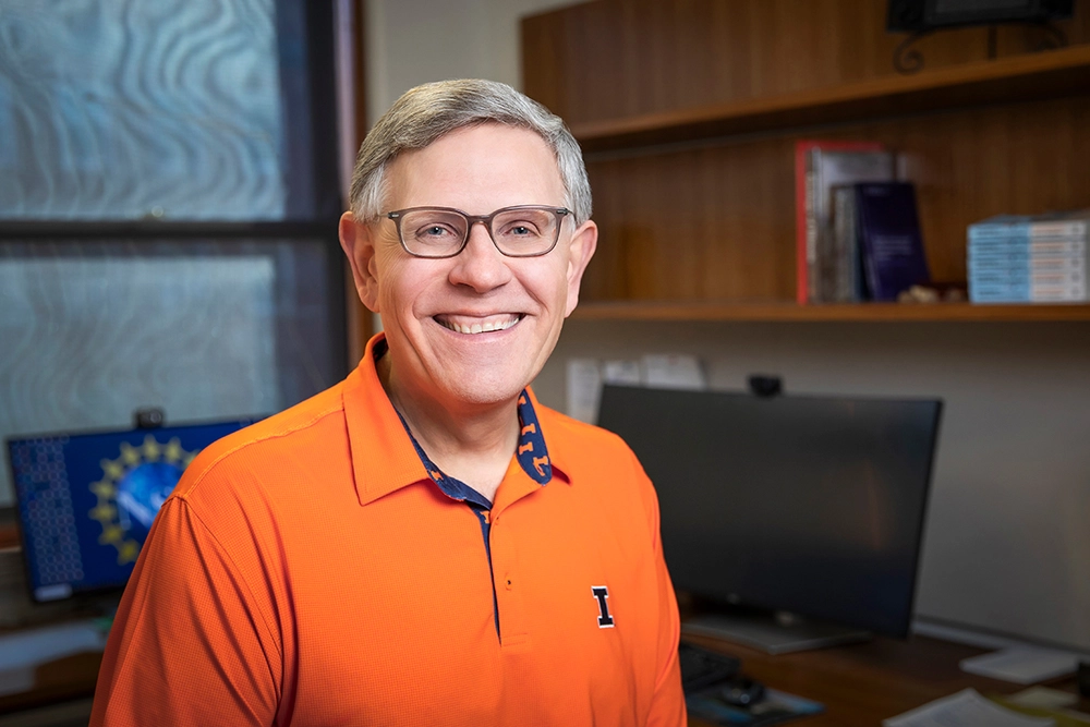 Kelvin Droegemeier standing in front of a computer.